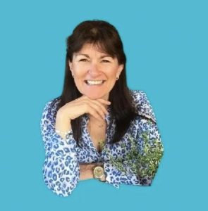Paula Fenegan on blue background